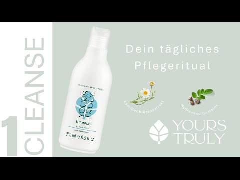 weiße-flasche-yours-truly-deep-cleansing-shampoo-mit-aufdruck-alle-haartypen-daneben-text-dein-tägliches-pflegeritual-und-abbildungen-von-kamillenblütenextrakt-und-pflanzensamen-verlinkung-zu-youtube-video