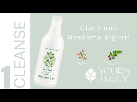 weiße-flasche-yours-truly-smoothing-shampoo-mit-aufdruck-geschmeidigkeit-daneben-text-glanz-und-geschmeidigkeit-und-abbildungen-von-arganöl-und-pflanzensamen-verlinkung-zu-youtube-video