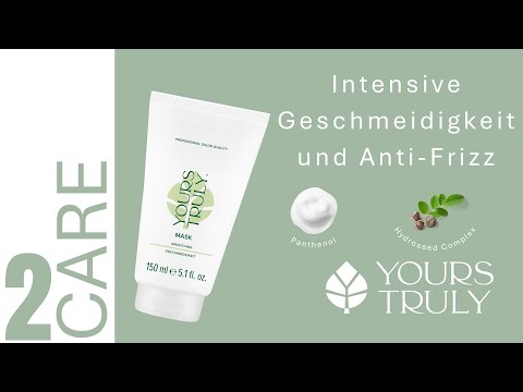 weiße-tube-yours-truly-smoothing-mask-mit-aufdruck-geschmeidigkeit-daneben-text-intensive-geschmeidigkeit-und-anti-frizz-und-abbildungen-von-panthenol-und-pflanzensamen-verlinkung-zu-youtube-video