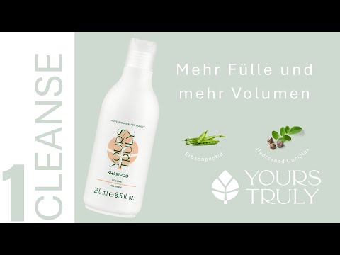 weiße-flasche-yours-truly-volume-shampoo-mit-aufdruck-volumen-daneben-text-mehr-fülle-und-mehr-volumen-und-abbildungen-von-erbsenpeptid-und-pflanzensamen-verlinkung-zu-youtube-video